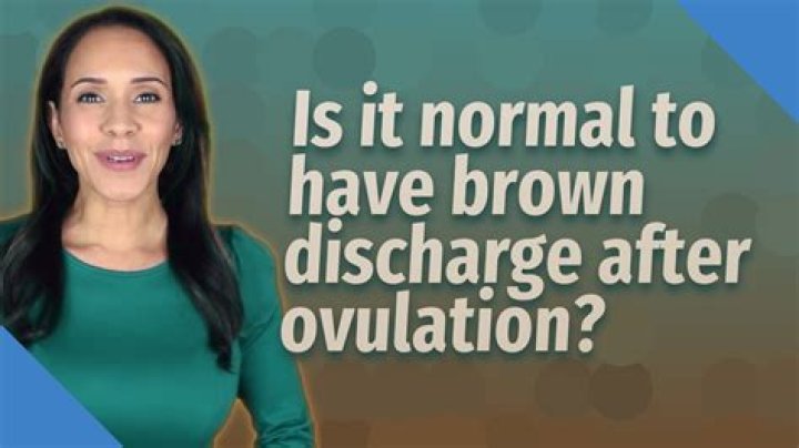 What causes brown discharge after ovulation?
