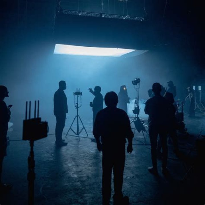 Who does lighting on a film set?