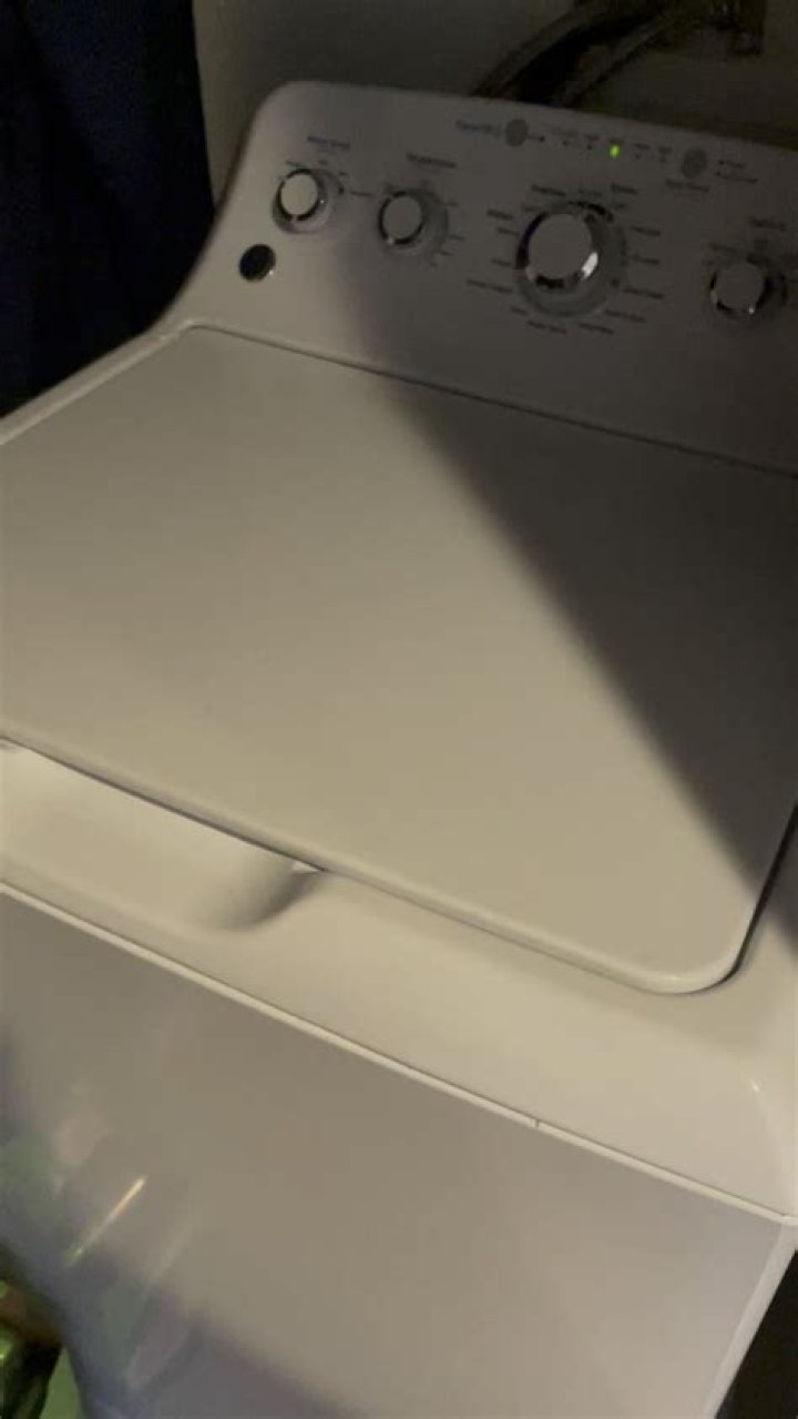 Why is my GE washer making a grinding noise?